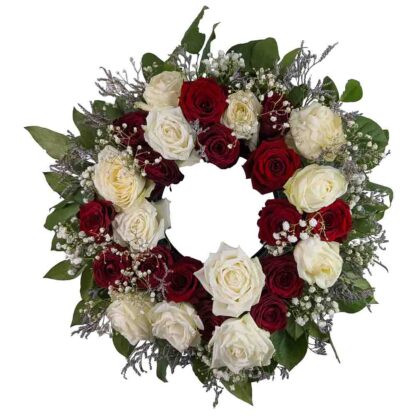 Begravningkrans med röda och vita rosor