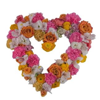 Begravningshjärta med rosa, gula och vita blommor